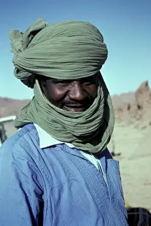 Head Scarf Prints: Africa, Algeria, Djanet oasis. Touareg person in the desert