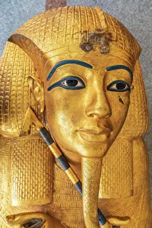 Emily Wilson Prints: Africa, Egypt, Cairo. Gold-painted ceramic replica of King Tutankhamun's gold coffin