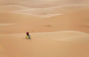 Jaynes Gallery Prints: Africa, Morocco, Erg Chebbi. Berber man sitting in desert