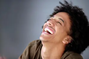 Curl Prints: African American man with huge afro smiles