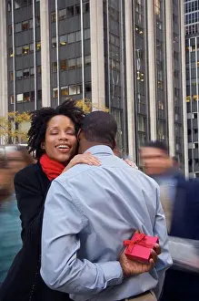 Husband Prints: African American man surprising wife with gift