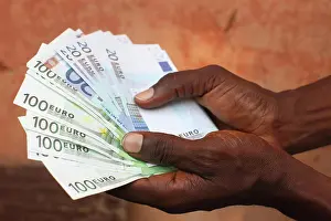 Money Prints: African holding Euros, Lome, Togo, West Africa, Africa