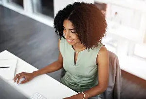 African woman, computer or notebook in planning