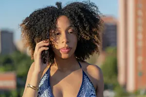 Afro Prints: afro girl talking from her smartphone