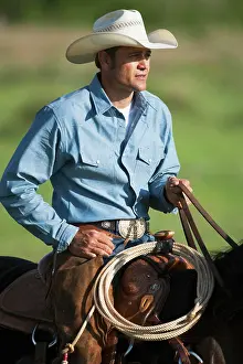 Horseback Prints: Agriculture - A cowboy on horseback on a western rangeland / Childress, Texas, USA