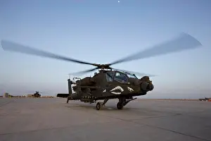 Stationary Prints: An AH-64D Apache Longbow Block III attack helicopter gets ready for take off at Camp Speicher