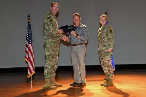 Air Force Prints: Airmen from the 628th Air Base Wing receive their quarterly award from Col