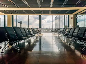 Terminal Prints: Empty airport departure area lounge on the background of the window