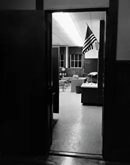 Doorway Prints: American flag seen from the door of a classroom