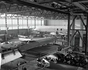 Schiphol Prints: Anefo photo collection. DC8 is being rebuilt at Schiphol