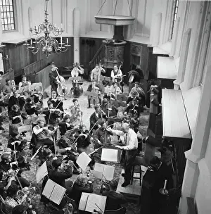 Rehearsal Prints: Anefo photo collection. Dutch student orchestra weather in Bergen to rehearse led by conductor Jan Brussen