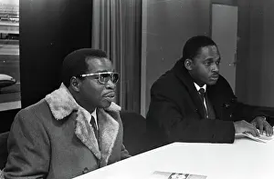 Press Prints: Anefo photo collection. Two Surinamese teachers at Schiphol during press conference left F