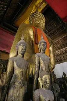 Verticals Prints: Antique wooden Buddhas in the former Provincial town of LUANG PROBANG - LAOS