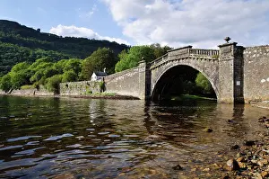 Coast Prints: Arched stone bridge at head of sea loch