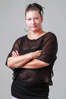 Denim Prints: Arm cross and tough Woman in her mid-thirties with her arms cross