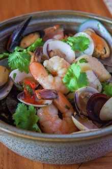 Assorted Prints: Aruban food, bowl of prawns and shellfish with garnish