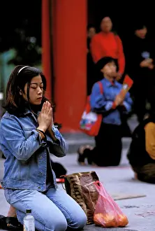 Prayer Prints: Asia, China, Hong Kong. Taoist worshippers at Won Tai Sin Templein Kowloon