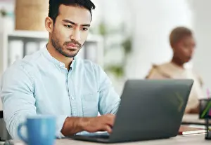 Expert Prints: Asian man, laptop and typing in startup office for planning