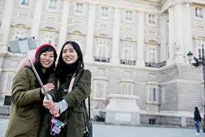 Visiting Prints: Asian women taking selfie on street