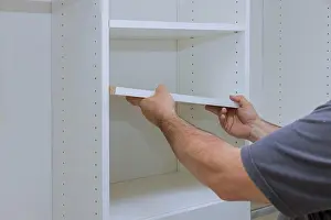Mounting Prints: Assembling shelves with home a new apartment installing wooden shelves on wall
