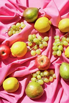 Still Life Prints: Assorted fruits on pink table cloth
