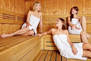 Attractive Prints: Three attractive women in sauna relaxing and talking