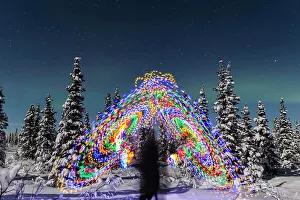 Exposure Prints: The Aurora Borealis Dances Over The Top Of A Vibrant Spiral Light Painting