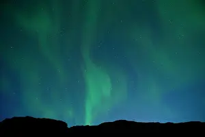 Explorations Prints: Aurora Borealis or Northern lights dancing in the sky above Iceland