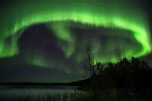 Finland Prints: Aurora Borealis and stars over lake at night, Muonio, Lapland, Finland, September