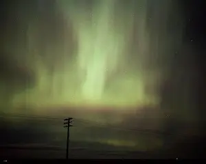 Fiery Prints: Auroral Flames Light Up the Night Sky