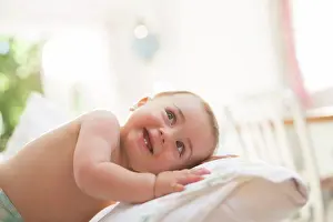 Bare Chest Prints: Baby boy leaning on pillow, London, UK