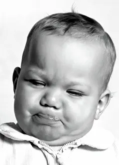 Sweater Prints: Baby's funny pouty face captures pure emotion