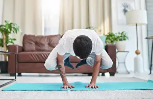 Dedicated Prints: Balance, power and strength with man in living room of apartment for development or holistic fitness