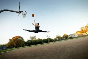 Sports Ball Prints: Ballet dancer mid-air jumping playing basketball on an outdoor court