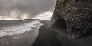 Peninsula Prints: basalt columns cave over black sand beach