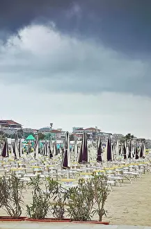 Diminishing Prints: Beach umbrellas and sun loungers on beach, Pescara, Abruzzo, Italy