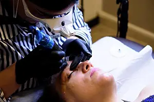 Thirty Prints: Beautician wearing black gloves