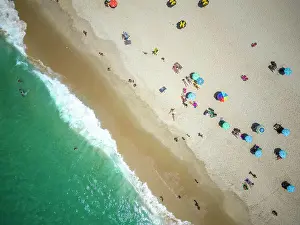 Aerial Photo Prints: Beautiful top down aerial view to beach umbrellas, green ocean water