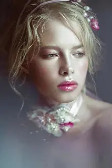 Chic Prints: Beautiful blond fashion girl with flowers on the neck and in her hair
