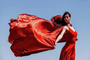 Grownups Prints: Beautiful female dancer with red scarf looking away against clear sky on sunny day