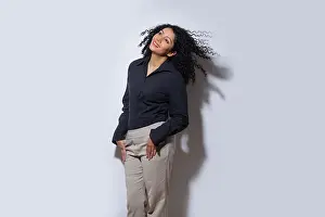 Smart Prints: Beautiful female fashion model posing with both hands in pockets