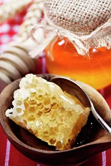 Isolated Prints: Beautiful honey comb, spoon and honey in jar