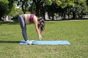 Thirty Prints: Beautiful pregnant woman doing sport in summer park