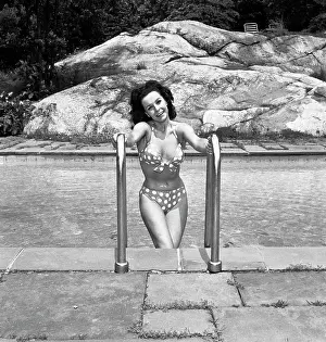 Relaxation Prints: Beautiful woman in bikini at swimming pool