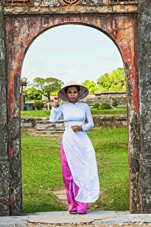 Beautiful Woman Prints: beautiful woman exploring the imperial palace in Hue / Vietnam