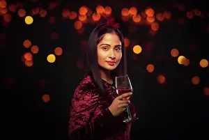 Occasion Prints: Beautiful woman holding a wine glass at a party