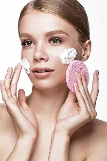 Naturalness Prints: Beautiful young girl with sponge and foam cleanser and French manicure