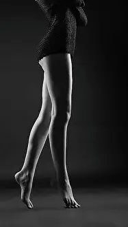 Chic Prints: Beauty naked women legs silhouette in dark
