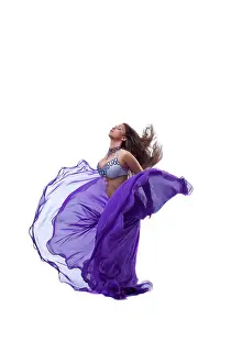 Chic Prints: Beauty young girl dance in purple arabic oriental costume with flying veil and hairs