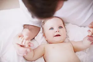 Break Prints: Bed, dad and relax with baby in home for relationship